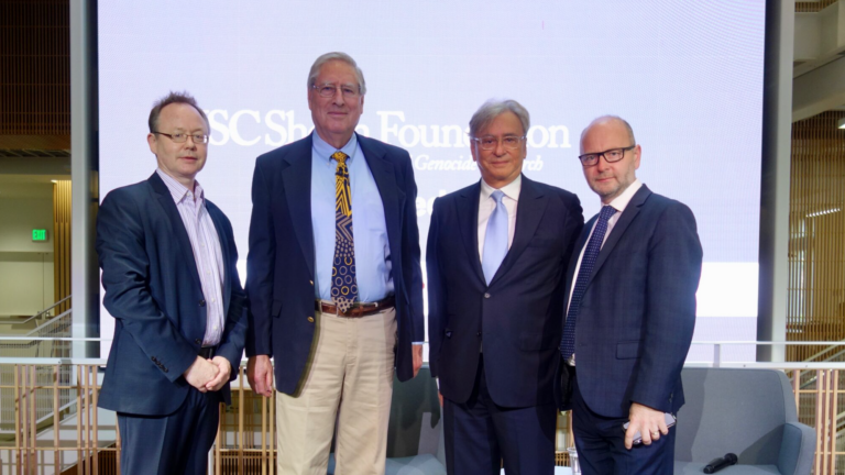 From left to right, Wolf Gruner, Christopher Browning, Mickey Shapiro, and Stephen Smith pose for a picture, dressed formally.